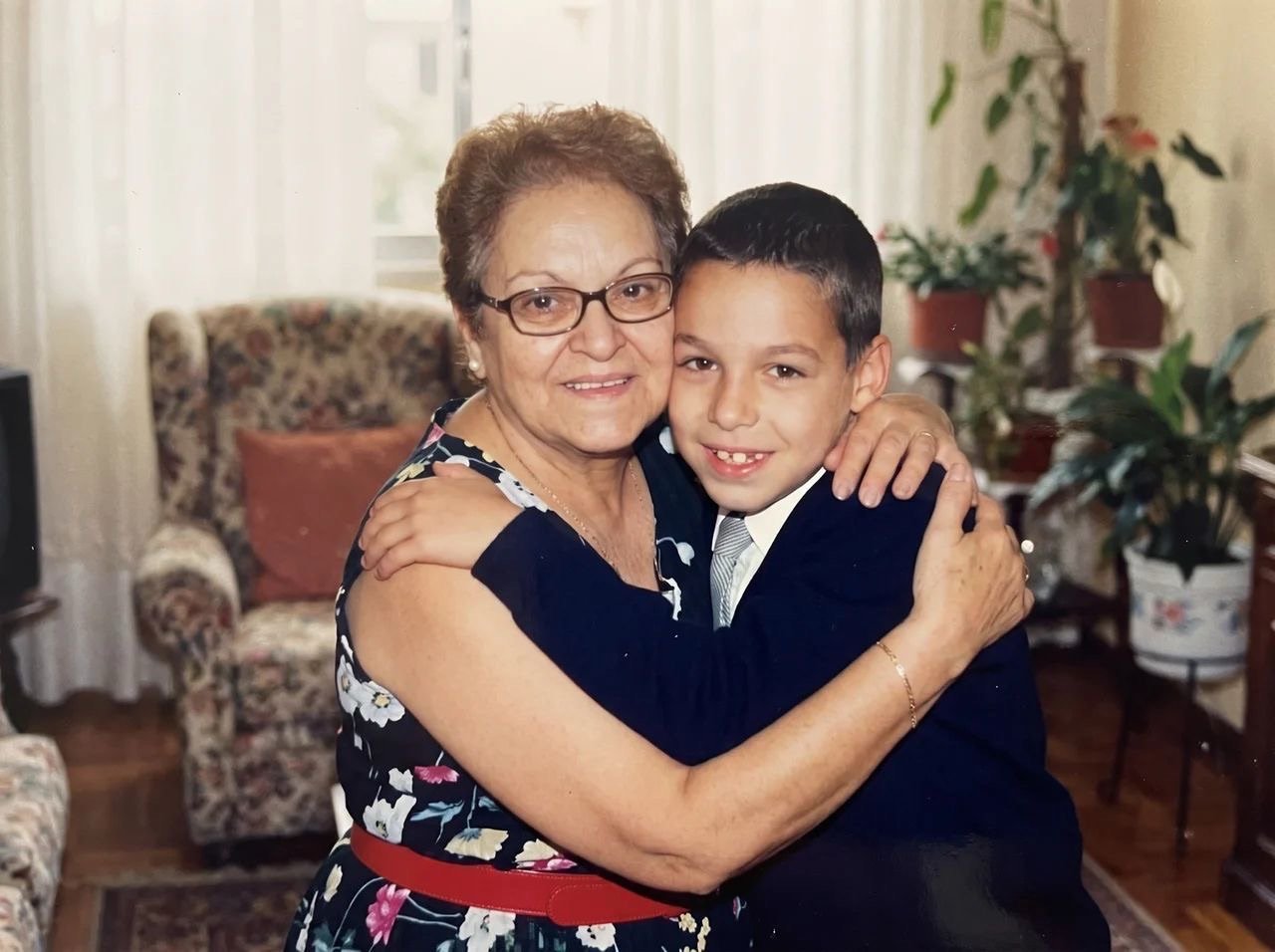 Killian as a child embracing his grandmother