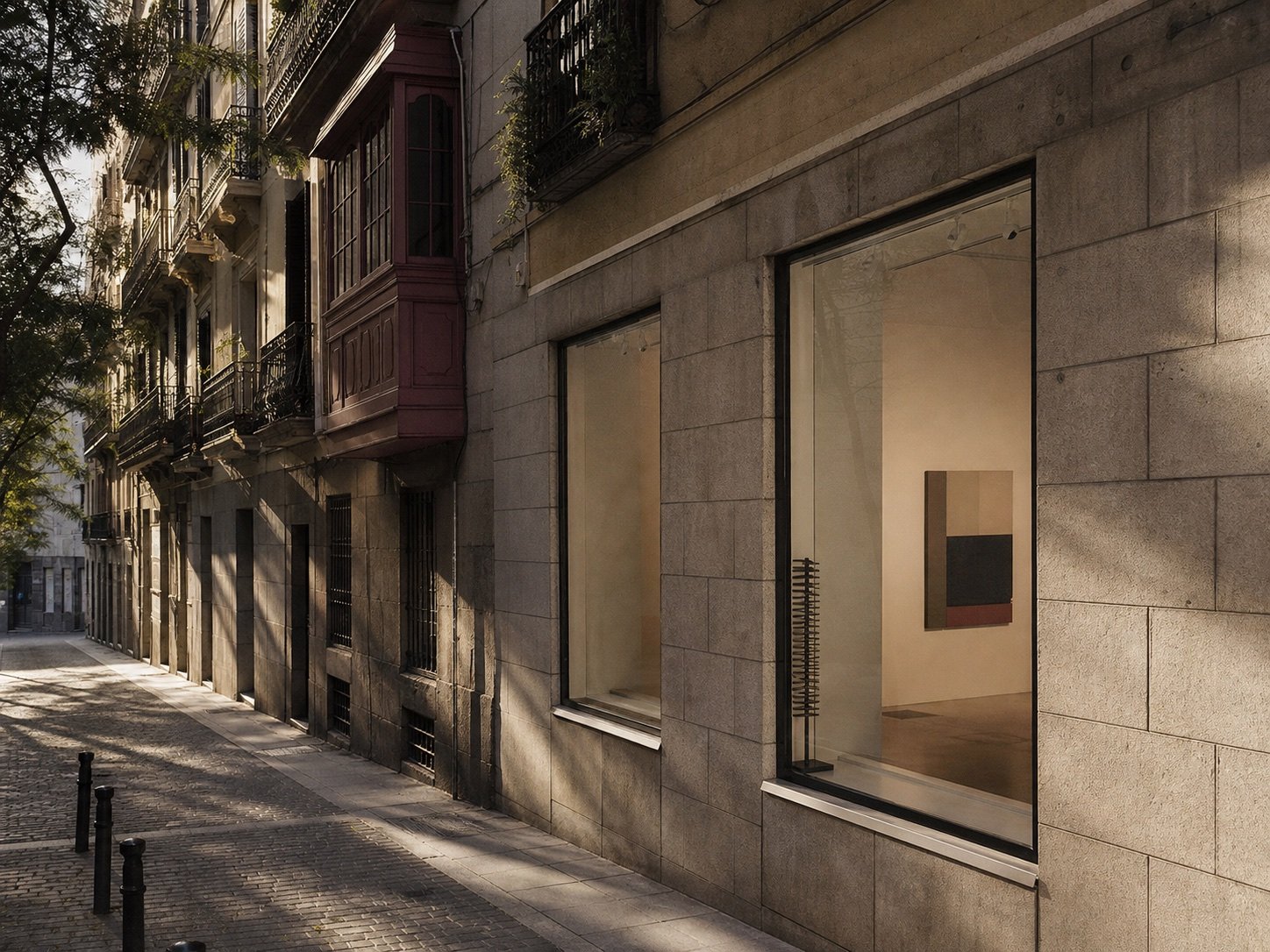 A Madrid street with architecture and a contemporary gallery